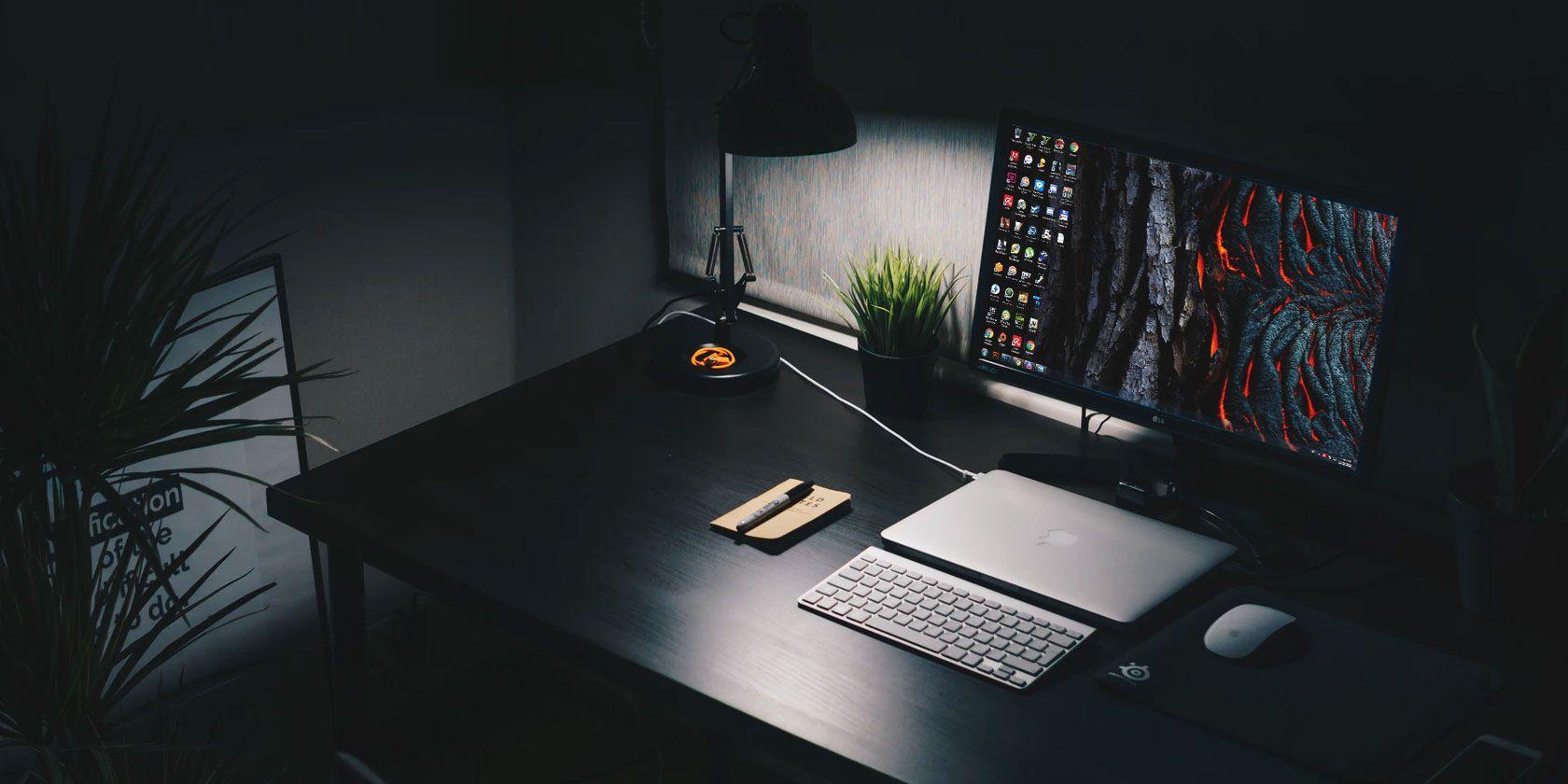 Goggle Studio web design workspace — dark setup with dual monitors